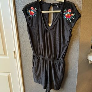 Cute black romper with flowers